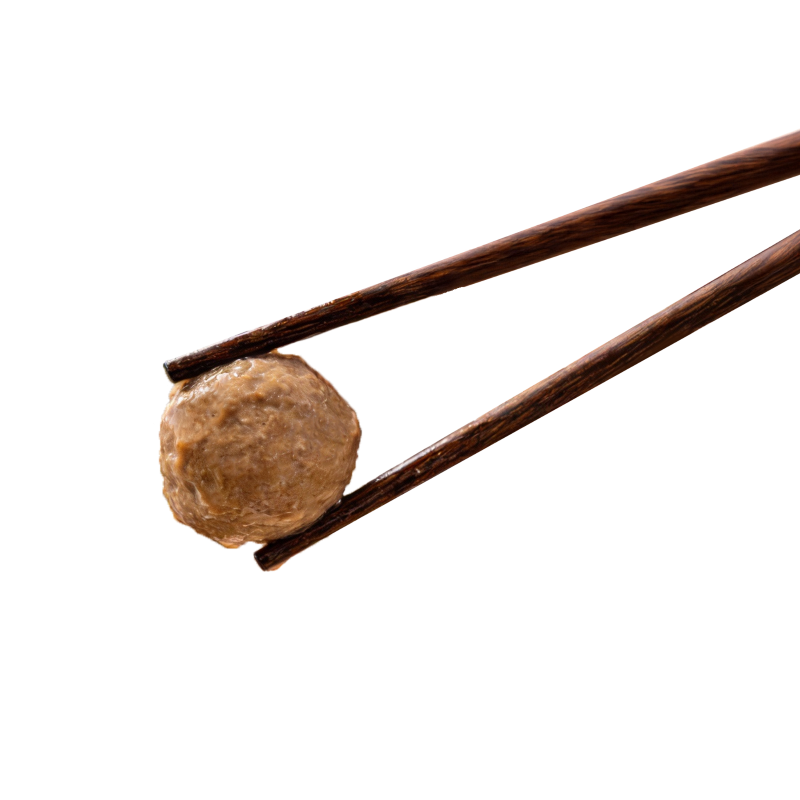 Meatball held with chopsticks